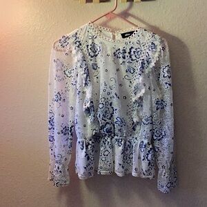fancy Alice Blue white and blue floral blouse with riffles and sheer sleeves.